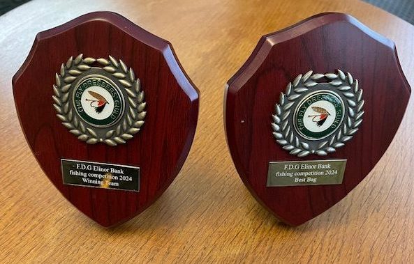 Trophies from the Elinor Bank Fishing Competition on display at the Tuesday evening meeting